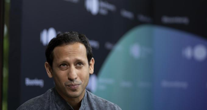 Nadiem Makarim, chief executive officer of Go-Jek, listens during a Bloomberg Television interview on the sidelines of the Bloomberg New Economy Forum in Singapore, on Tuesday, Nov. 6, 2018. The inaugural New Economy Forum aims to bring together leaders from public and private sectors to find solutions to the world's greatest challenges. Photographer: Wei Leng Tay/Bloomberg