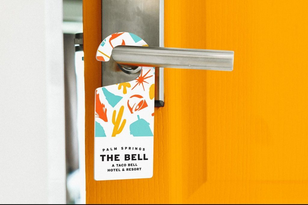 The-Bell_-A-Taco-Bell-Hotel-and-Resort-Door-Hanger--e1558037693695.jpg